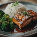 Teriyaki glazed salmon served with rice and vegetables